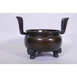 A large Japanese bronze censer, raised on tripod supports, AF detached, bowl 40cm diameter, 47cm