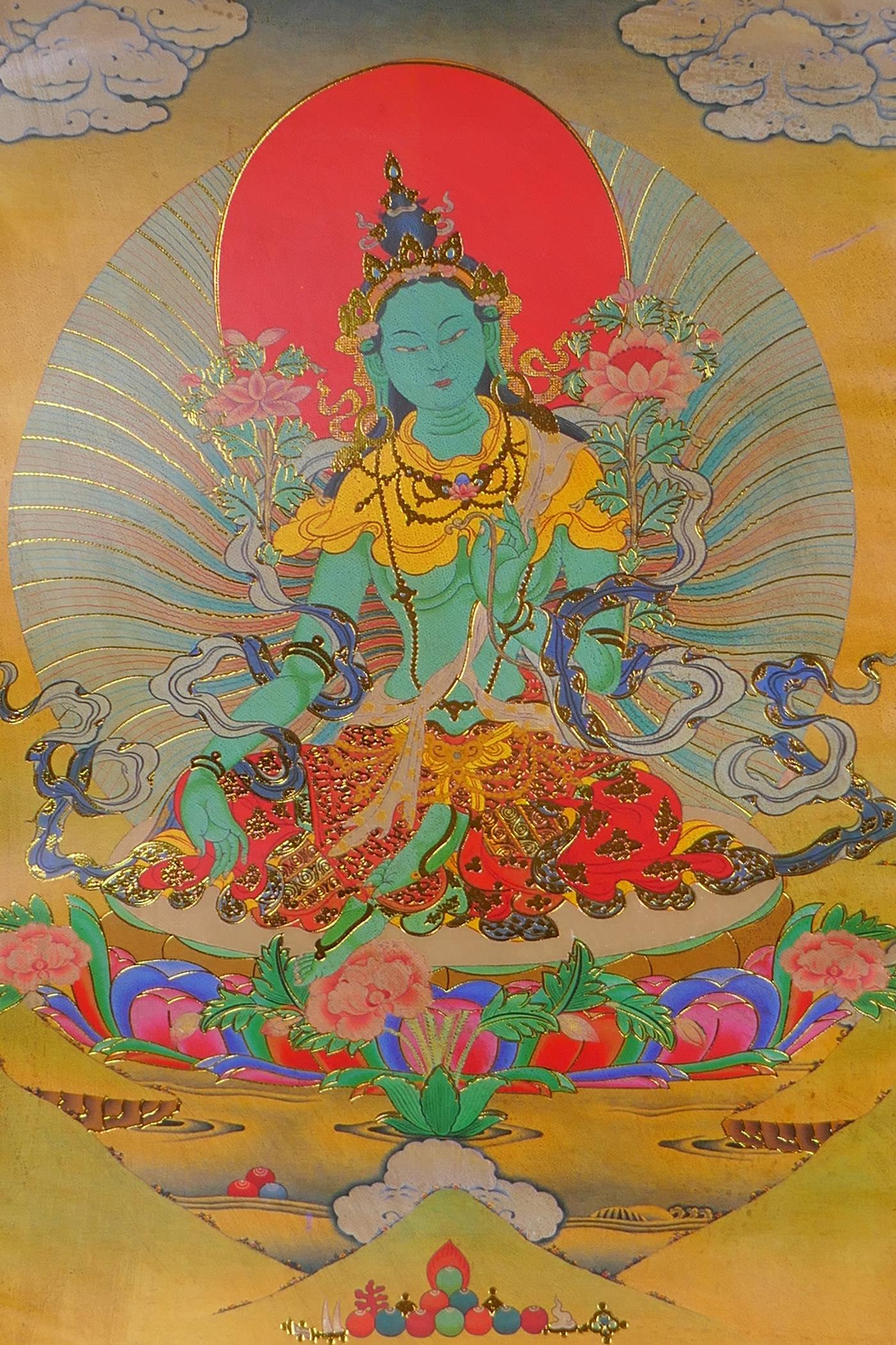 A Tibetan printed Thangka with gilt details, on a silk scroll mount, 49 x 62cm - Image 2 of 2