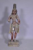 An Indian carved and painted wood Buddhistic figure, 92cm high