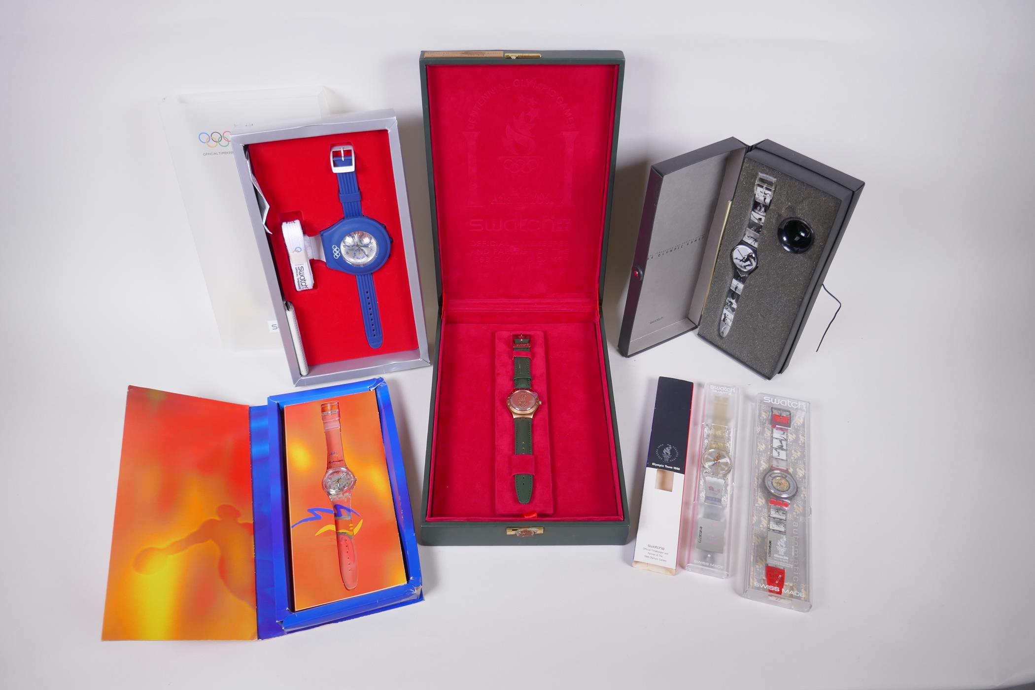 A collection of Swatch watches relating to the Olympic Games including a boxed limited edition '