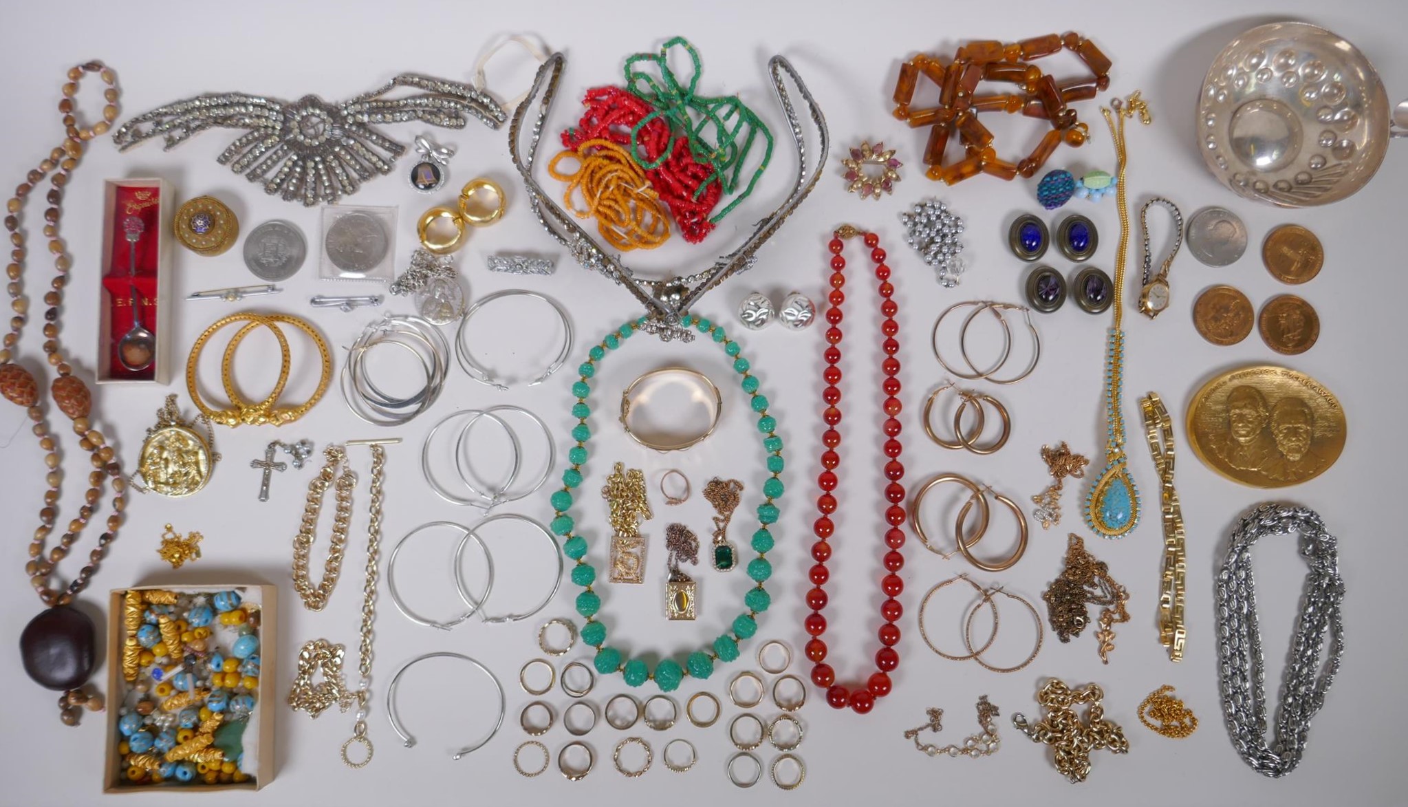 A quantity of vintage costume jewellery including a tiara, bangles, necklaces etc, together with a