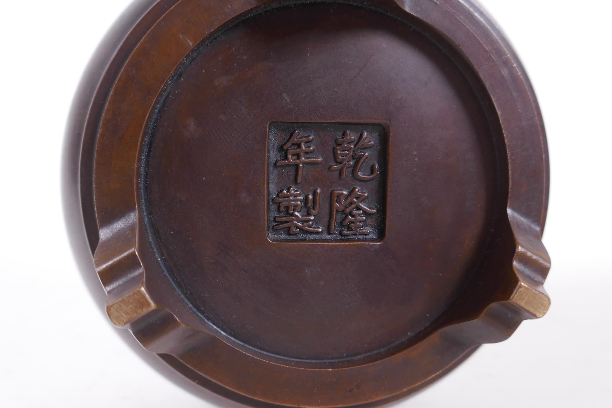 A Chinese bronze censer on tripod supports, the pierced cover in the form of a flame, impressed mark - Image 4 of 4