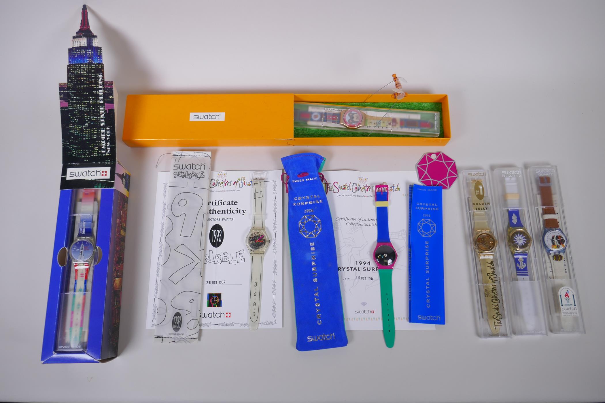 A collection of Retro Swatch watches including The Swatch Collectors of Swatch Golden Jelly 1991,