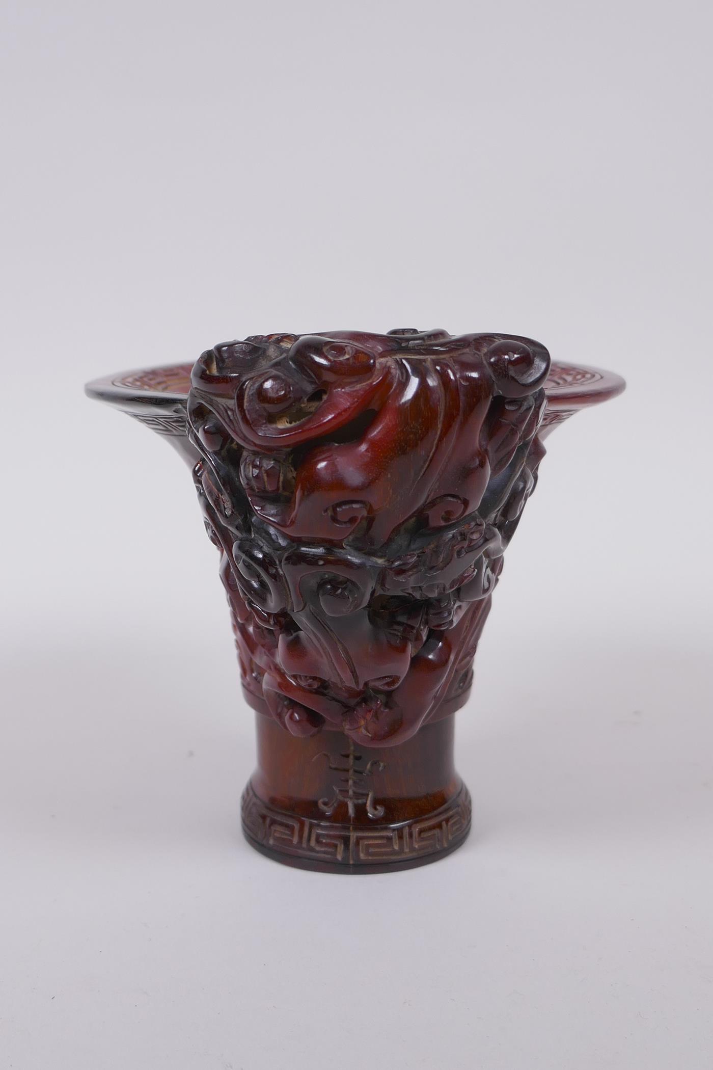 A Chinese horn libation cup with climbing kylin decoration, character mark to base, 12cm high - Image 4 of 5