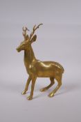 A filled gilt bronze figure of a stag, 29cm high