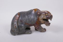 A Chinese carved soapstone tiger, 23cm long