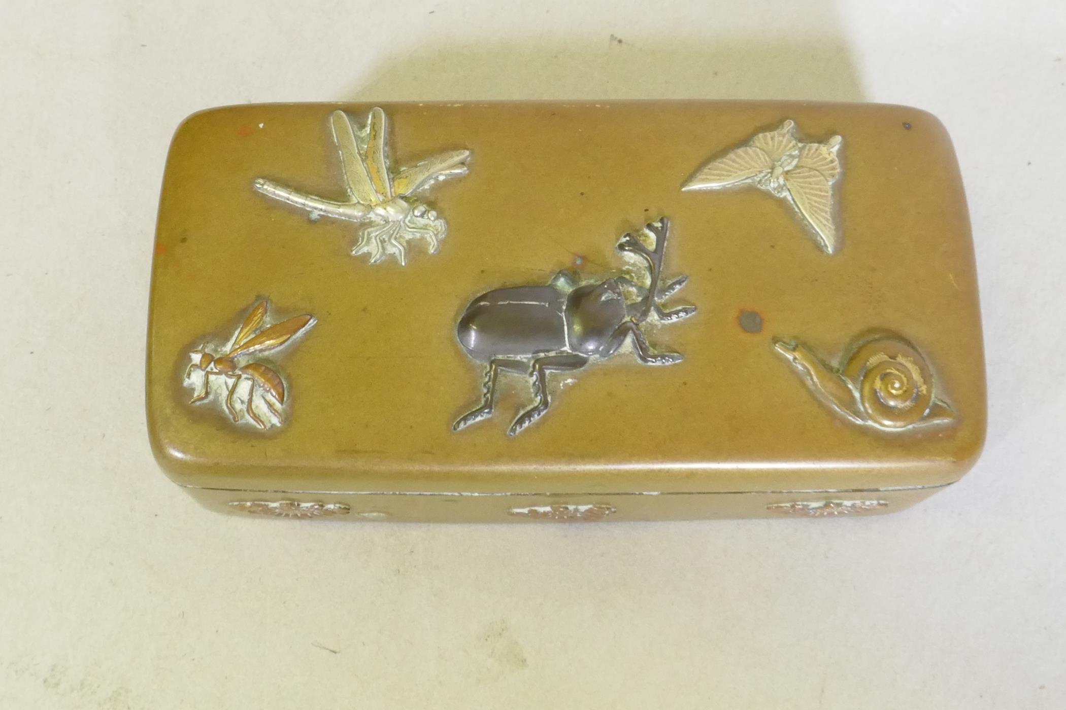 A Japanese Meiji period brass stamp box with raised multi-metal decoration of beetles, dragonfly and - Image 2 of 5