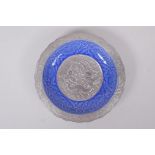A Chinese blue and silver glazed porcelain dish with lobed rim, decorated with a dragon, phoenix and