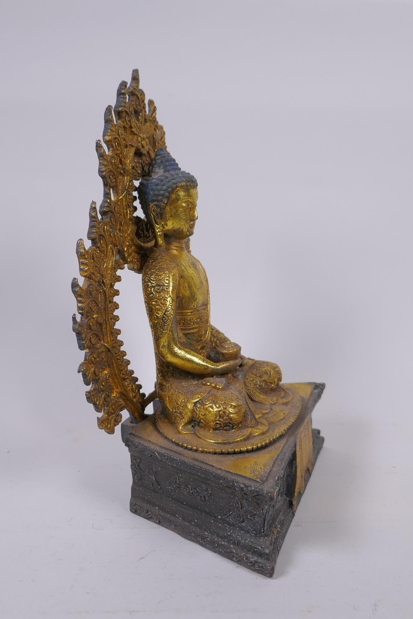 A Sino Tibetan gilt bronze figure of Buddha seated on a dias, Chinese 4 character mark verso - Image 3 of 7
