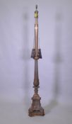 A copper and bronzed metal floor lamp with fluted column and Renaissance Revival style decoration,