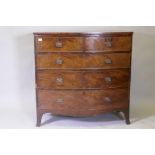 A Georgian mahogany bowfront chest of two over three drawers with cock beaded detail and brass plate