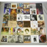 A collection of Bob Dylan vinyl LPs, including Desire, Street Legend, Hard Times, Slow Train Coming,