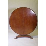 A Victorian mahogany tilt top breakfast table, with carved column and triform platform base raised