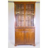 A George III mahogany bookcase, the upper section with astragal glazed doors and adjustable shelves,