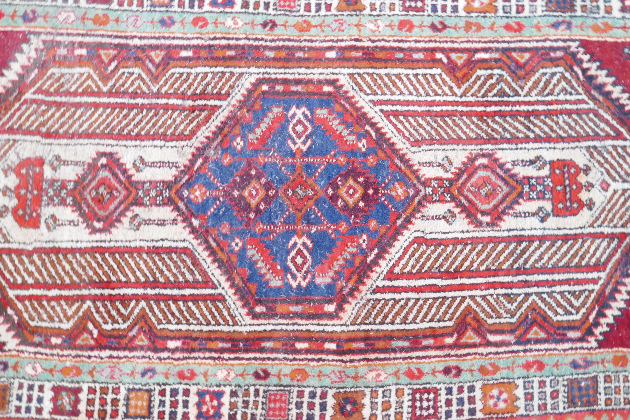 A red and blue ground flat weave runner, and a Persian red ground wool rug with a cream geometric - Image 8 of 8