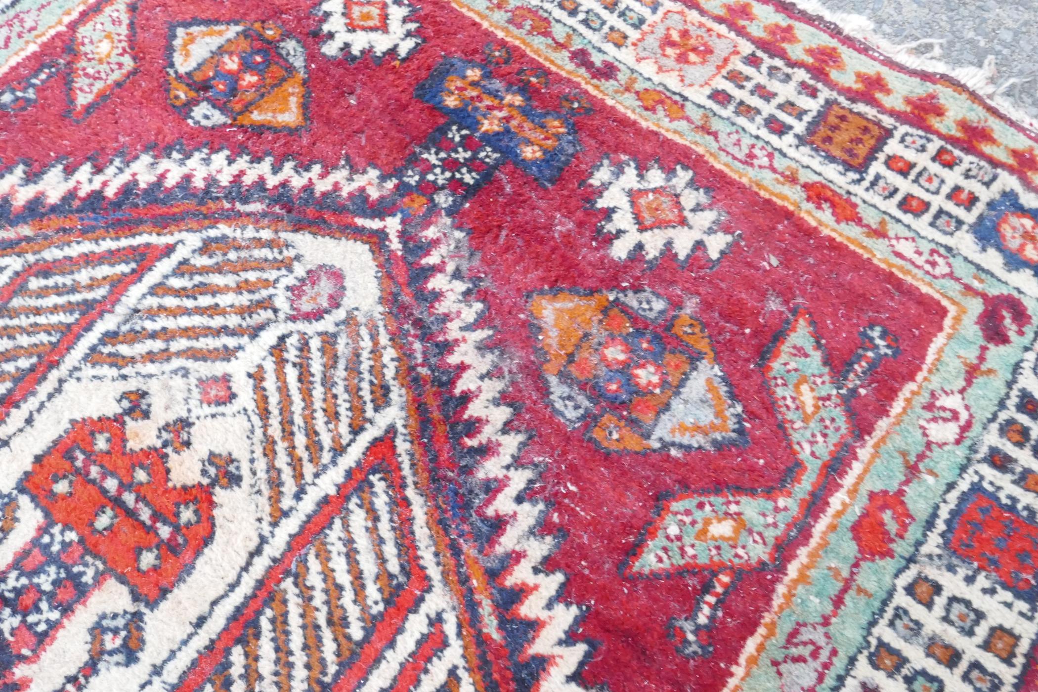 A red and blue ground flat weave runner, and a Persian red ground wool rug with a cream geometric - Image 4 of 8