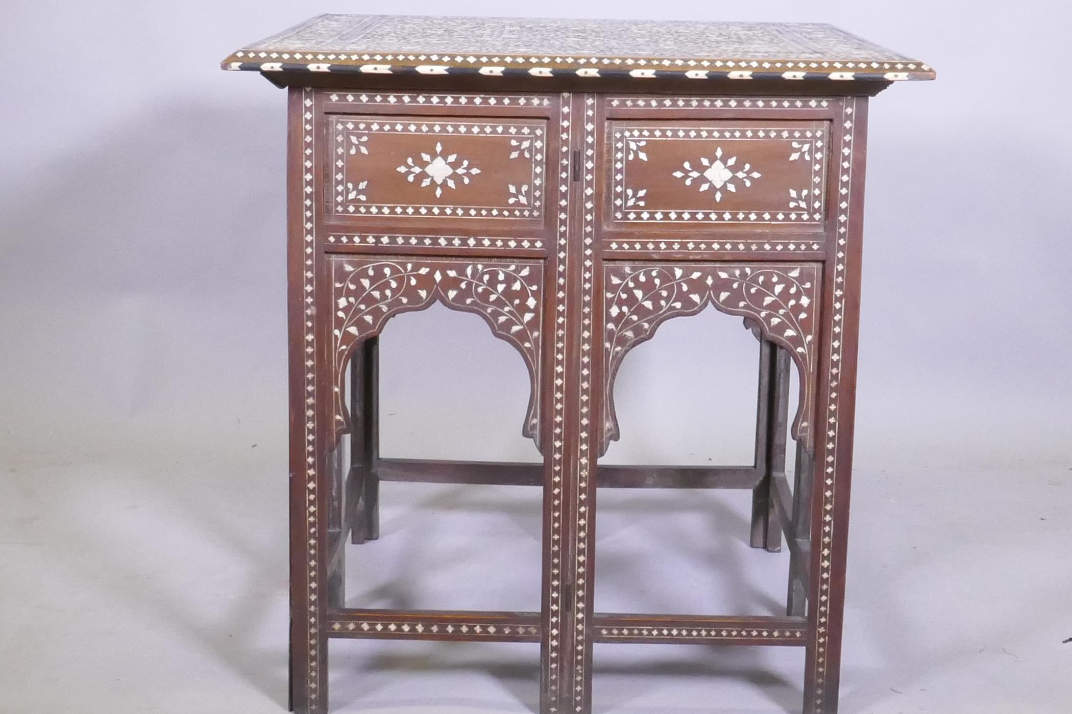 A C19th Moorish table with inlaid decoration and folding base, 61 x 61 x 63cm - Image 3 of 5
