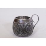 An C18th/C19th carved coconut cup with silver mounts, 4.5cm high