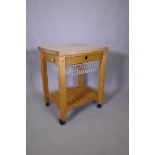 A beech wood kitchen island with chopping block top, single drawer and pull out basket and slatted