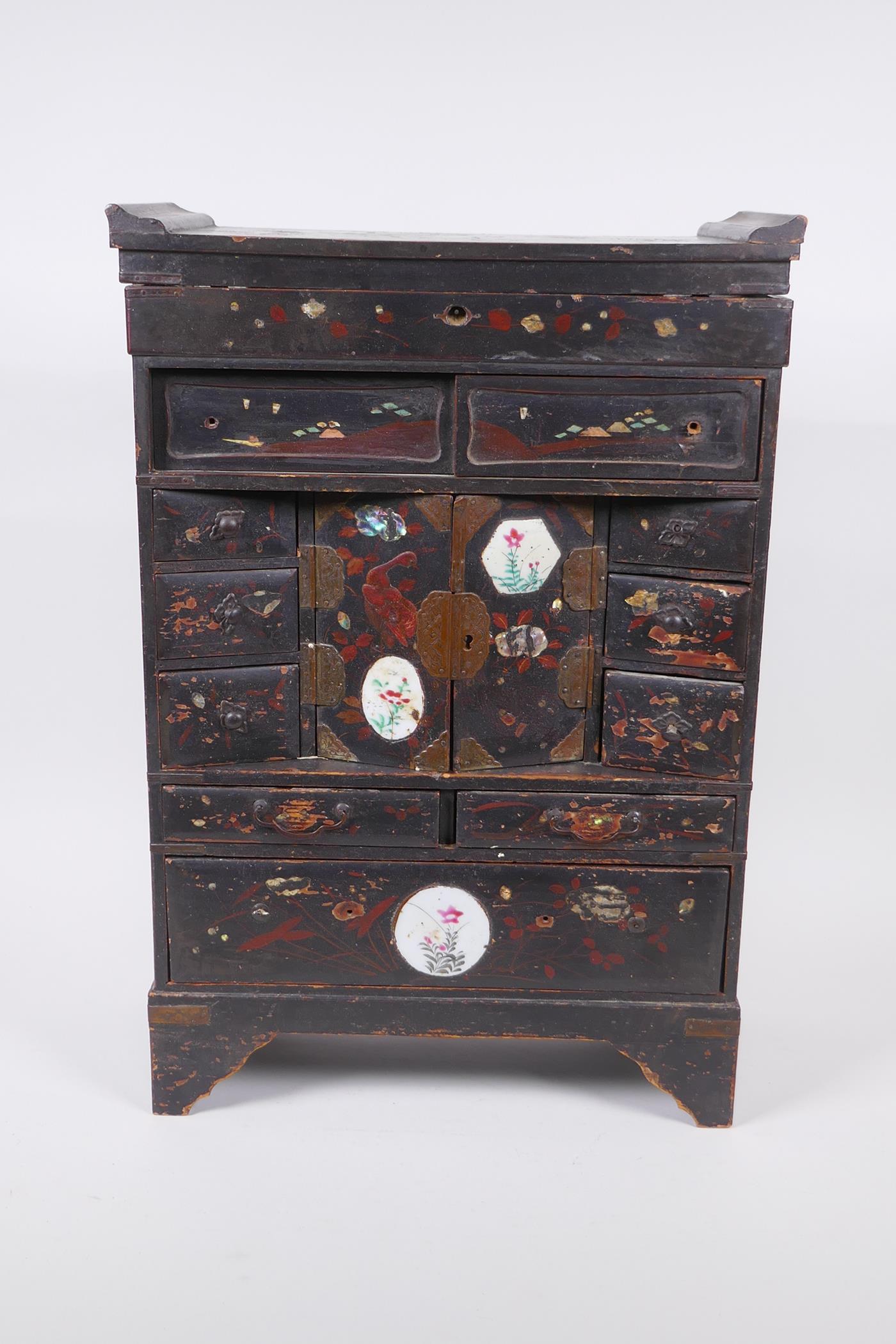 A Japanese Meiji period lacquer table top shodhana with inset porcelain panels, 31 x 14cm, 47cm high