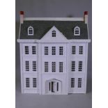 A large dolls' house, Tattershall Manor, in the form of a Georgian town house, the roof folding