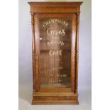 A C19th French pitch pine armoire with glazed door and sign-written decoration, 109 x 50 x 215cm