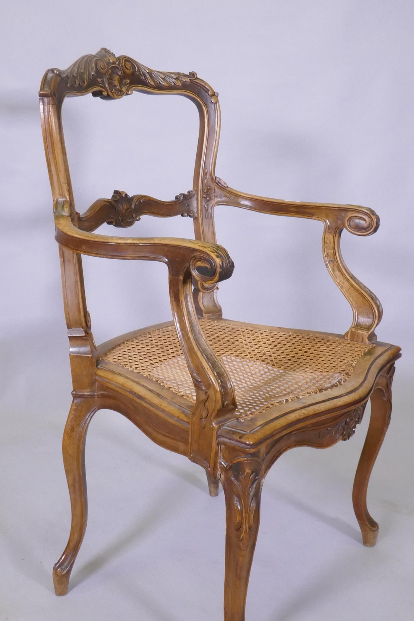 A C19th French carved walnut open arm chair with caned seat - Image 2 of 5