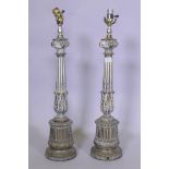 A pair of bronzed and painted metal table lamps, 68cm high