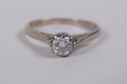 An 18ct white gold and diamond solitaire ring, size N/O