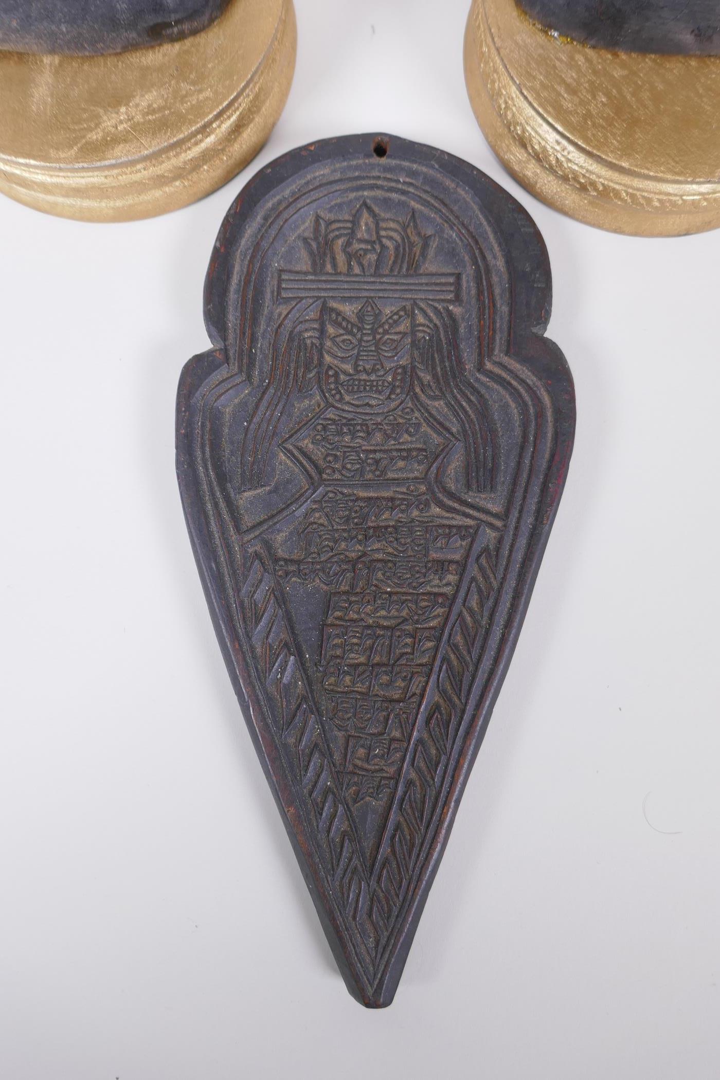 A pair of African carved hardwood figure groups, and a Tibetan carved wood plaque, largest 28cm high - Image 3 of 5