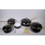 A set of Kitchen Kapers International Ltd 'Hild' enamelled cookware with brass handles, in the Ebony