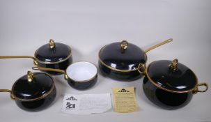 A set of Kitchen Kapers International Ltd 'Hild' enamelled cookware with brass handles, in the Ebony