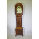C19th mahogany long case clock, with arched hood and painted dial, the spandrels decorated with