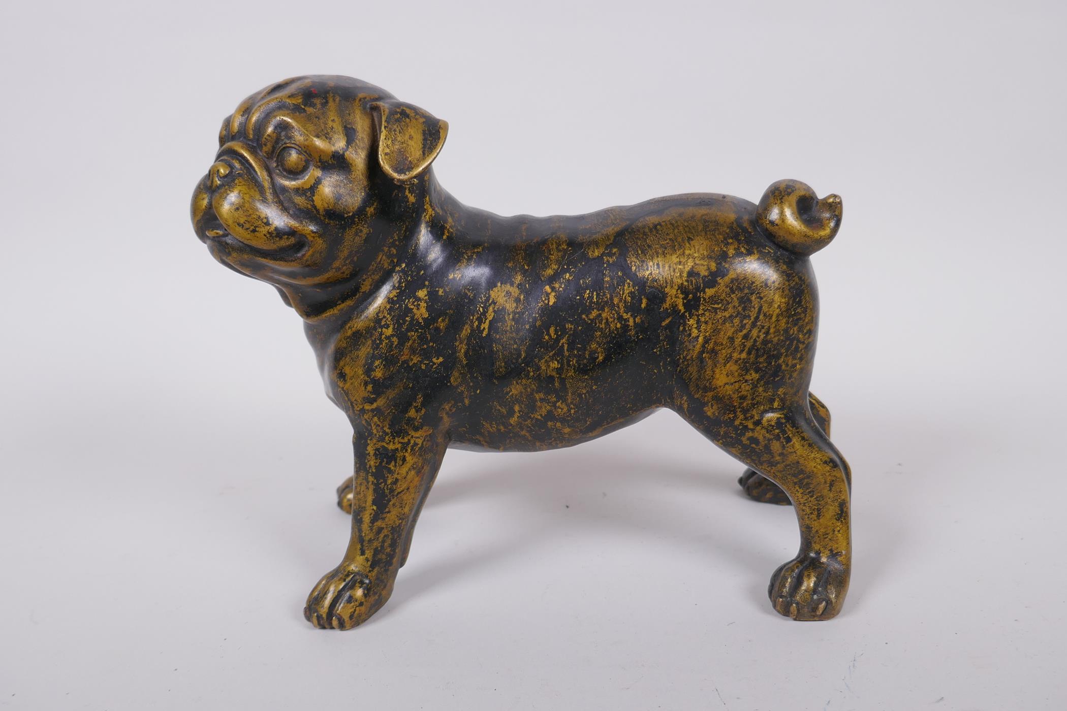 A gilt bronze pug dog, 21cm long