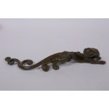 A Japanese style bronze okimono of a mythical beast, 16cm long