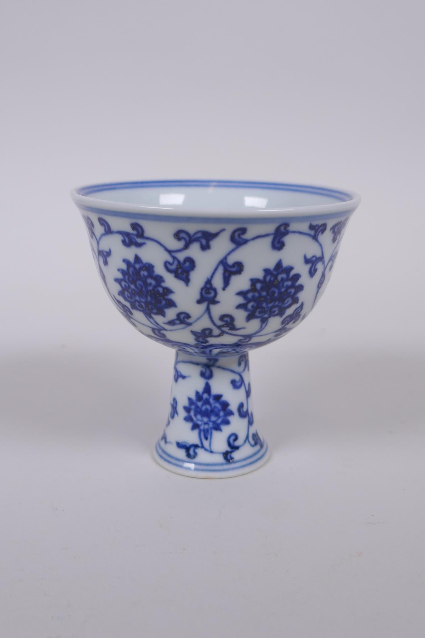 A blue and white porcelain stem cup with lotus flower decoration, Chinese Xuande 6 character mark to - Image 2 of 3