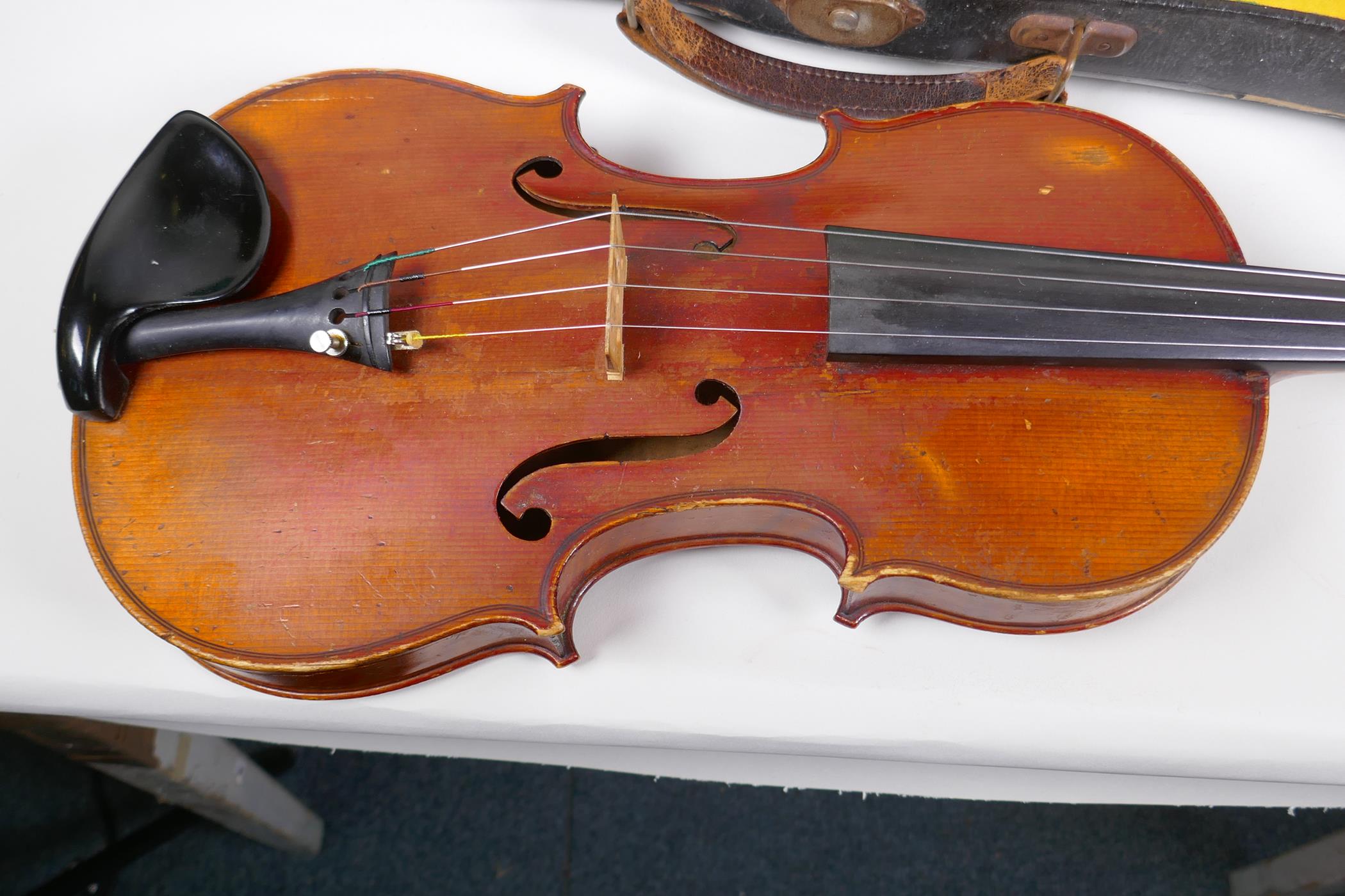 A vintage violin with two piece back and ebony pegs, with a bow and hard carry case, 60cm long - Image 6 of 7