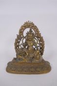 A Sino Tibetan bronze figure of a wrathful deity, seated on the back of a kylin, 20cm high