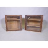 A pair of oak hanging cabinets with glazed doors and adjustable shelves, 49 x 49 x 20cm