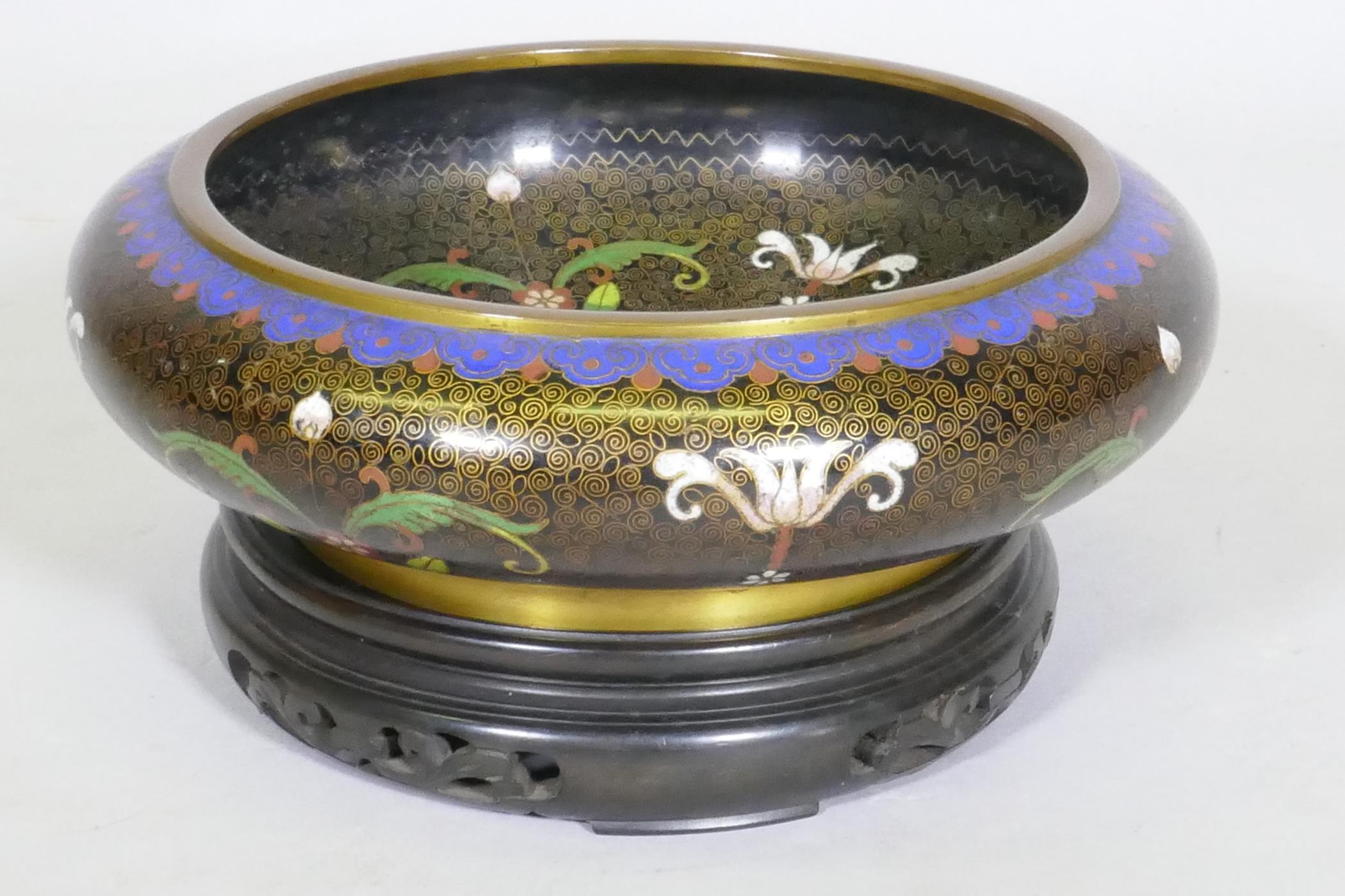 A Chinese cloisonne famille noire enamel bowl, four character mark to base, early C20th, 26cm