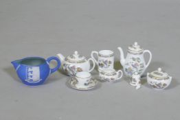 A Wedgwood miniature tea set and Jasperware motto jug, coffee pot 7cm high
