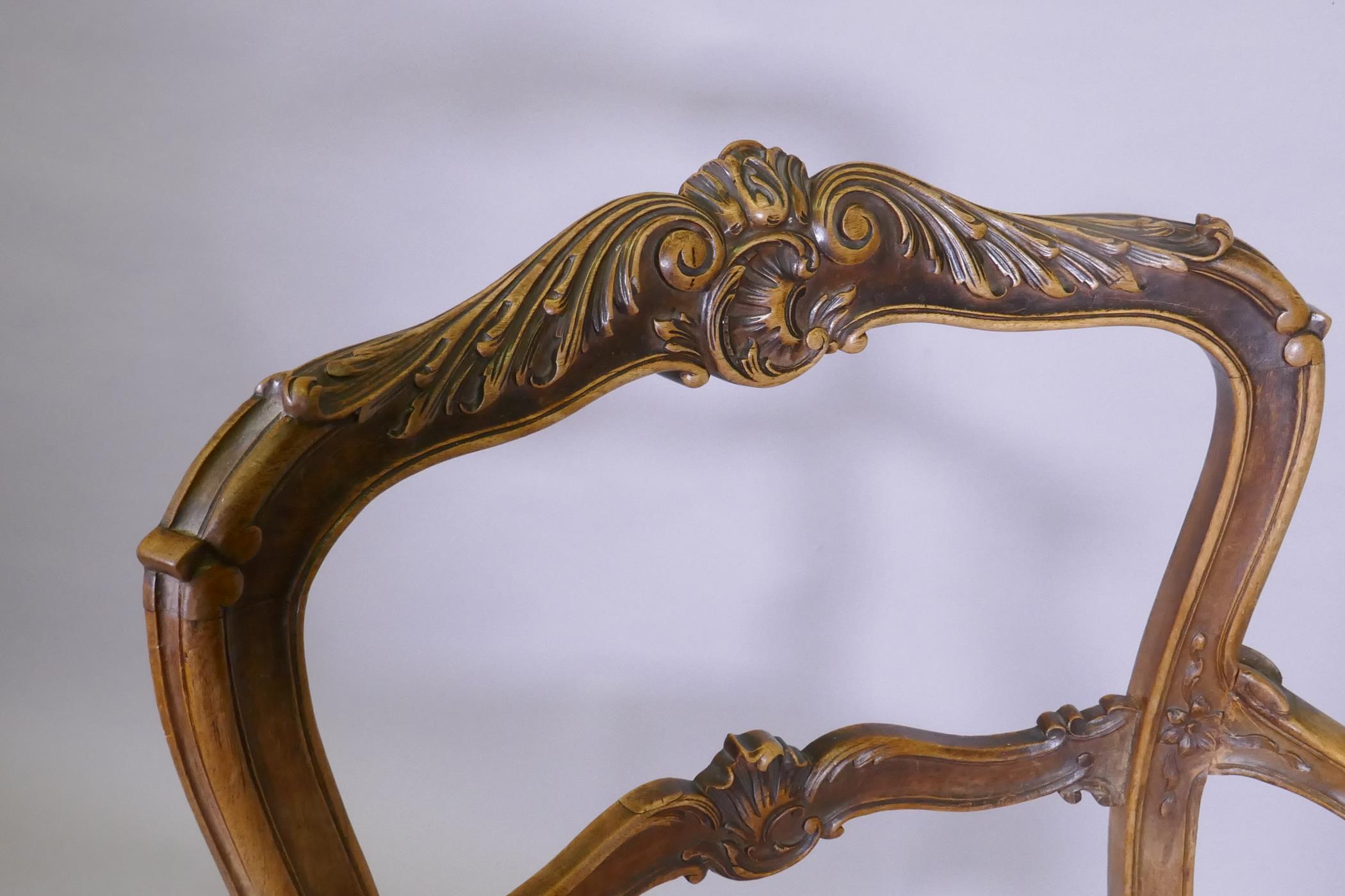 A C19th French carved walnut open arm chair with caned seat - Image 4 of 5