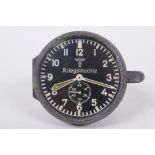 A German Third Reich WWII Kriegsmarine instrument panel clock by Junghans, with black dial,