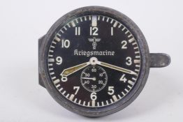 A German Third Reich WWII Kriegsmarine instrument panel clock by Junghans, with black dial,