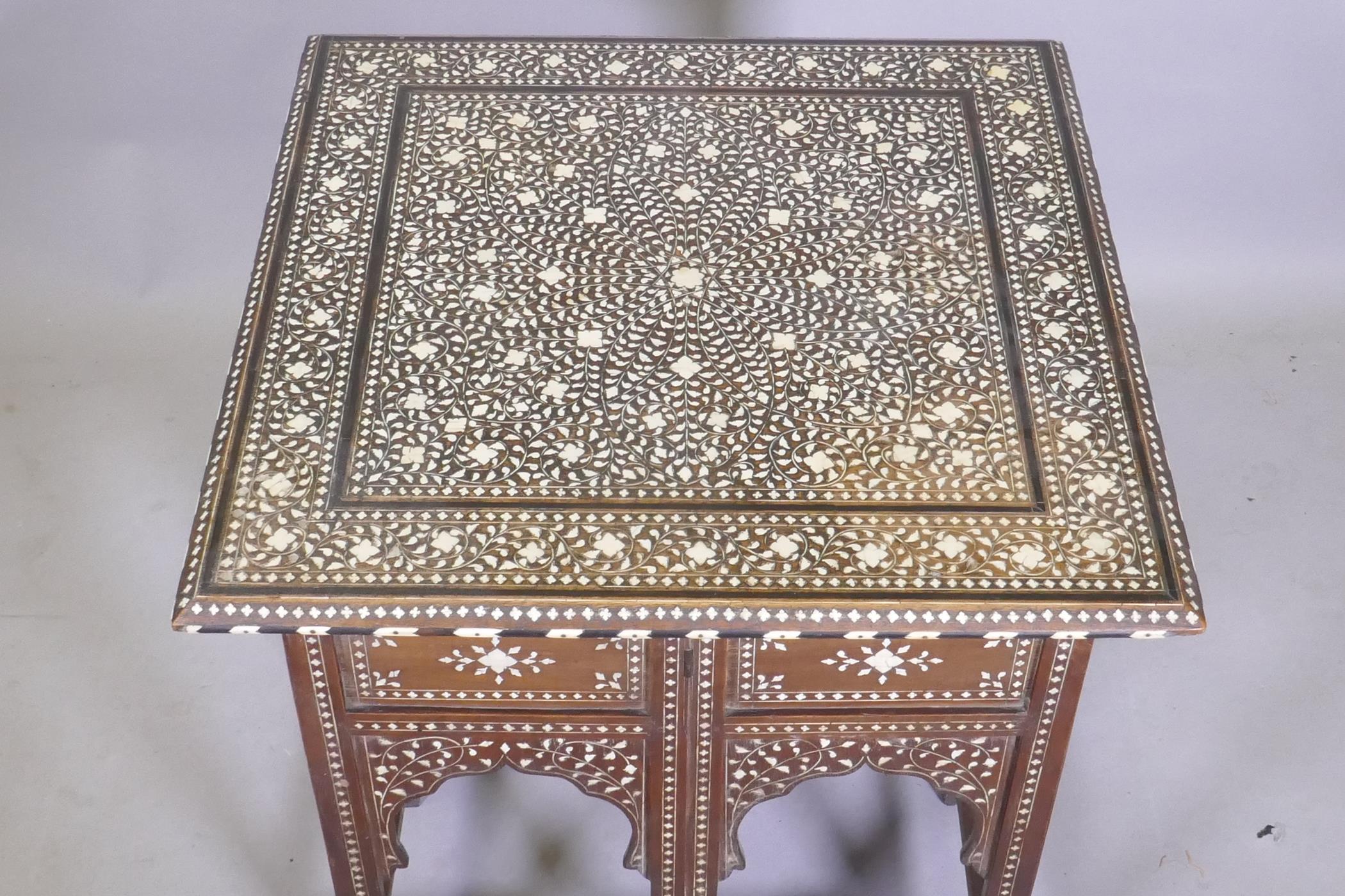 A C19th Moorish table with inlaid decoration and folding base, 61 x 61 x 63cm - Image 4 of 5