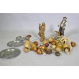 A collection of treen wood carvings of fruit, a composition model of a wood worker and a carved