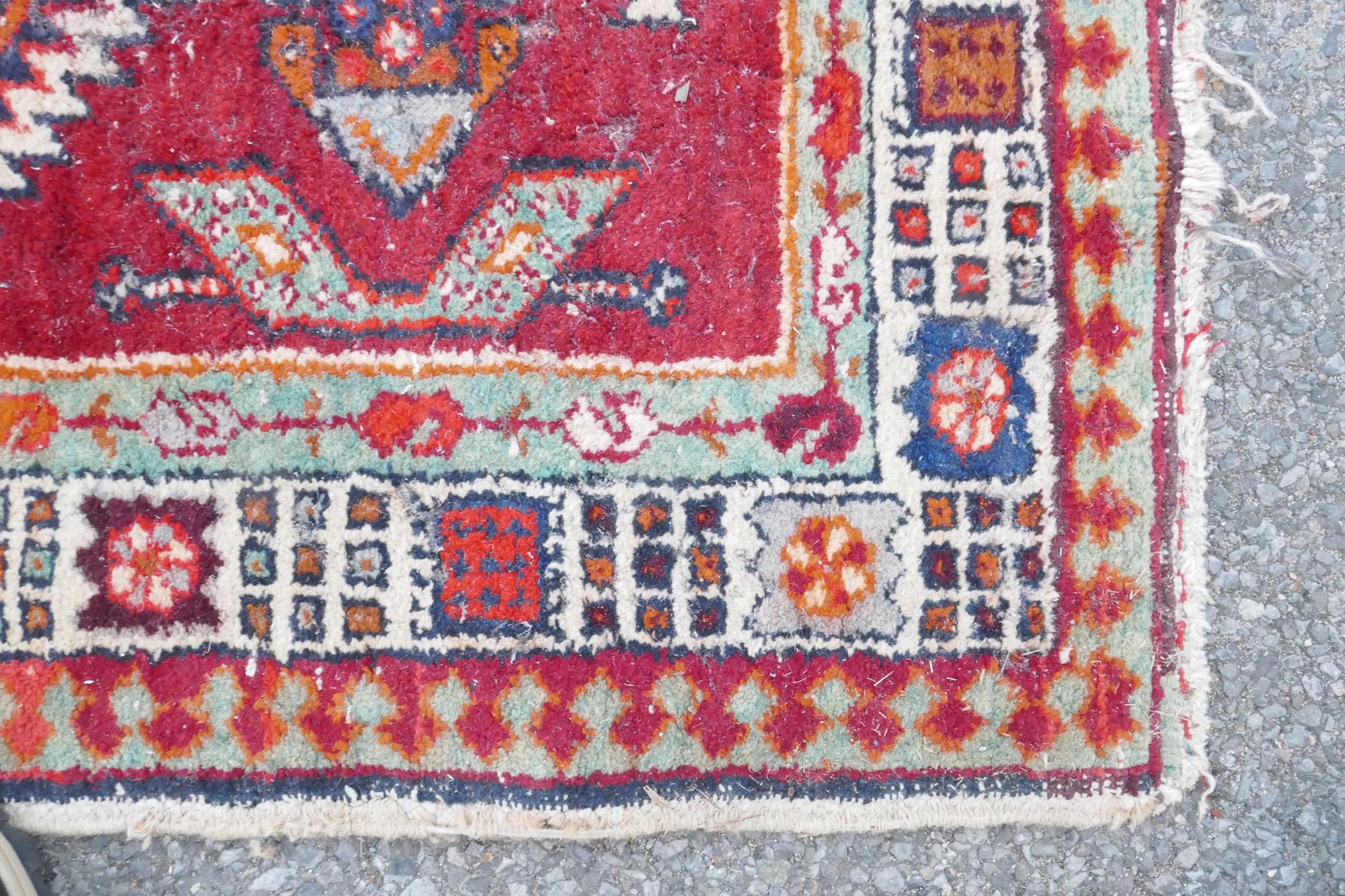 A red and blue ground flat weave runner, and a Persian red ground wool rug with a cream geometric - Image 5 of 8