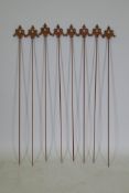 A set of eight cast iron gothic style plant stakes, 106cm long