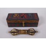 A Tibetan polished bronze vajra, in a fitted, carved and painted case, with script decoration to the