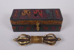 A Tibetan polished bronze vajra, in a fitted, carved and painted case, with script decoration to the